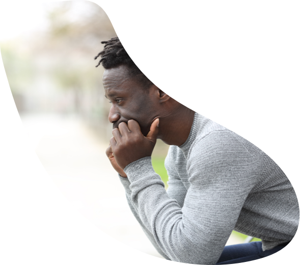 Man sitting in part looking concerned